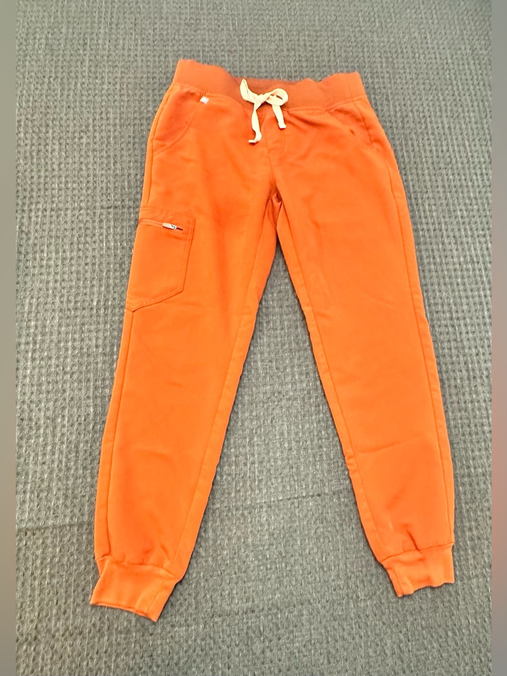 FIGS orange jogger scrub pants